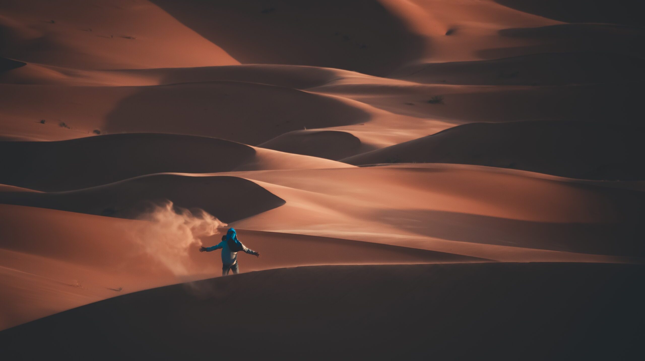 An adventurous young man in a desert