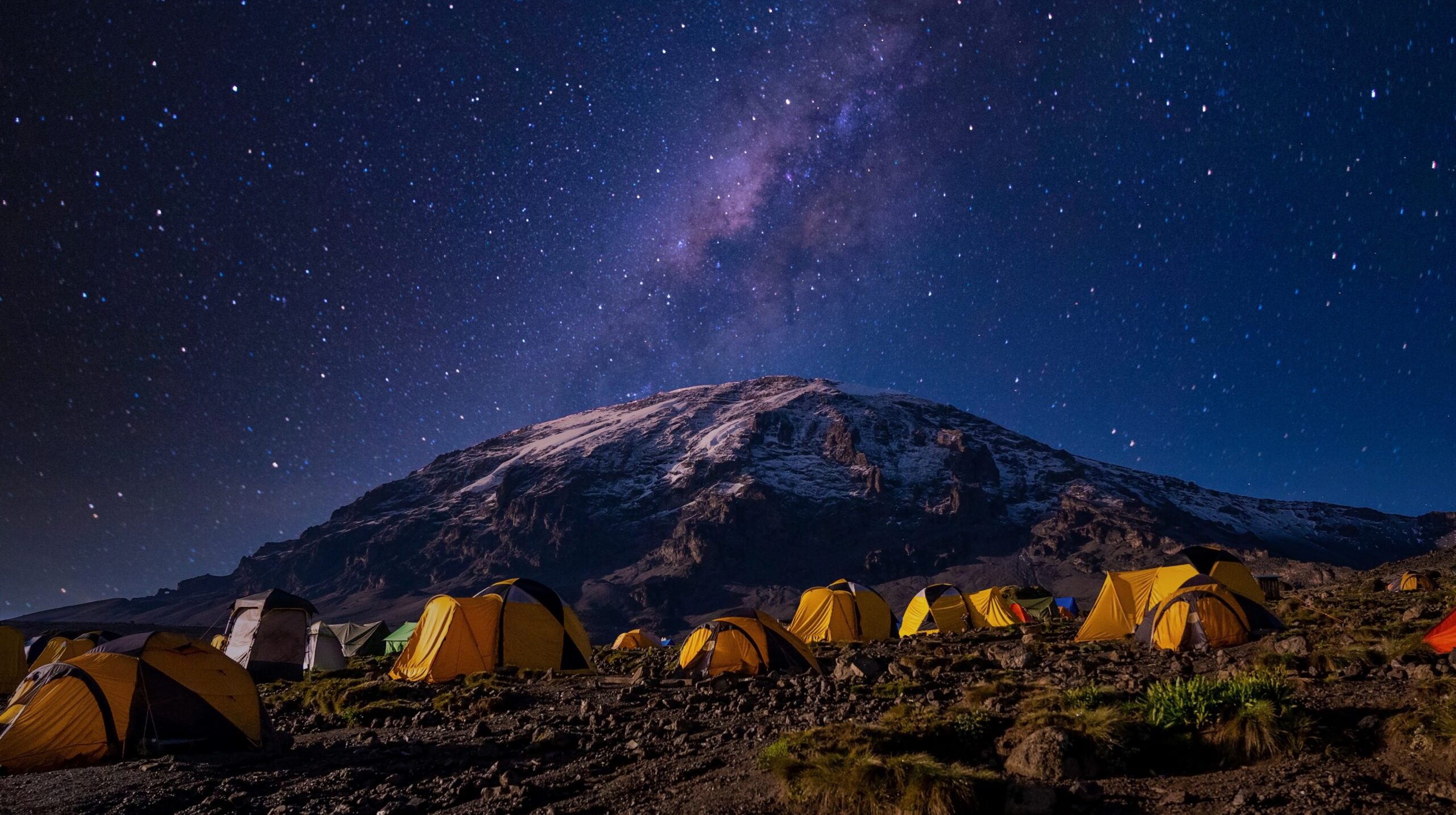 A beautiful scenery of yellow tents in the Kilimanjaro National Park