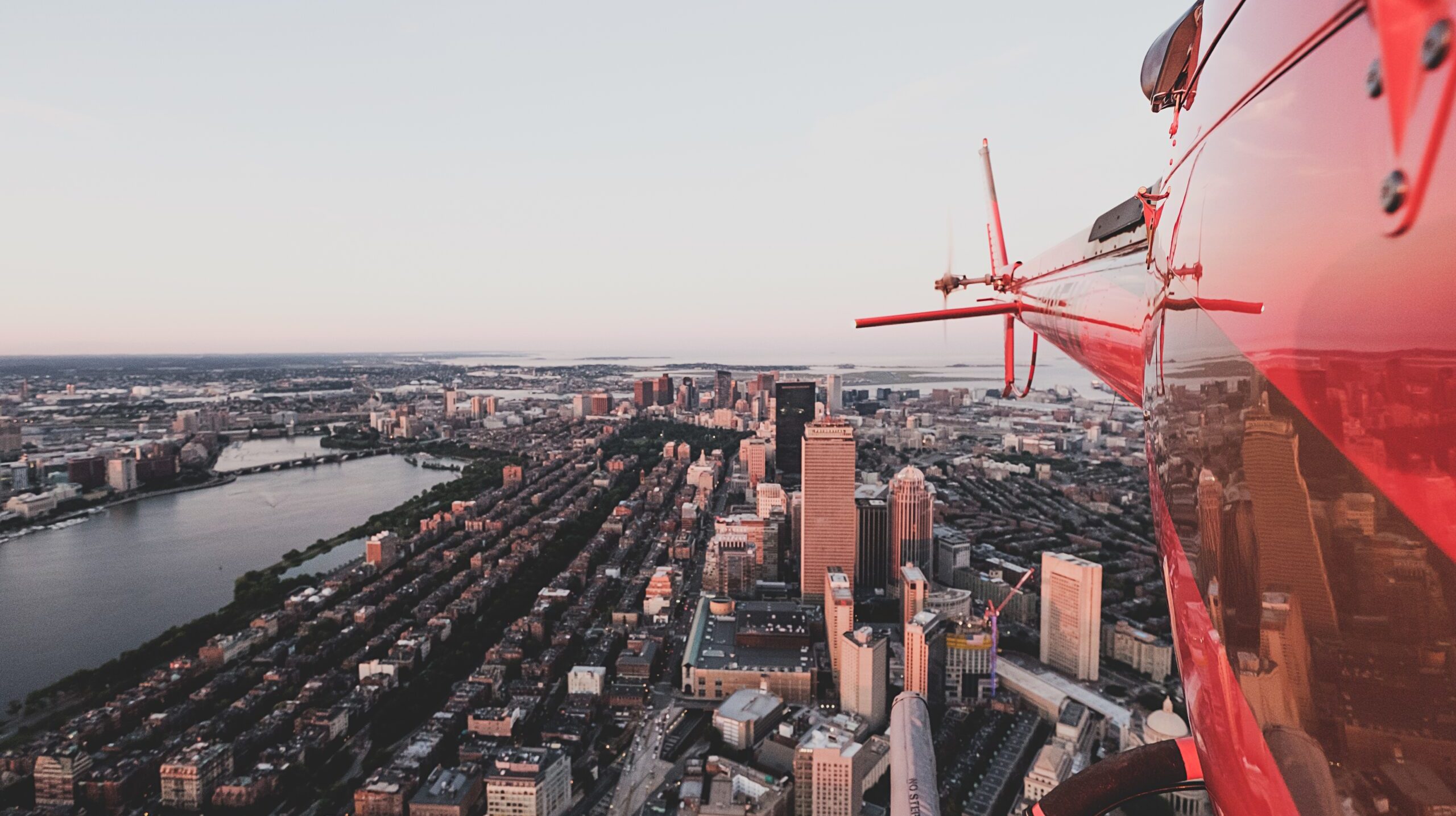 Beautiful urban city shot from a red helicopter