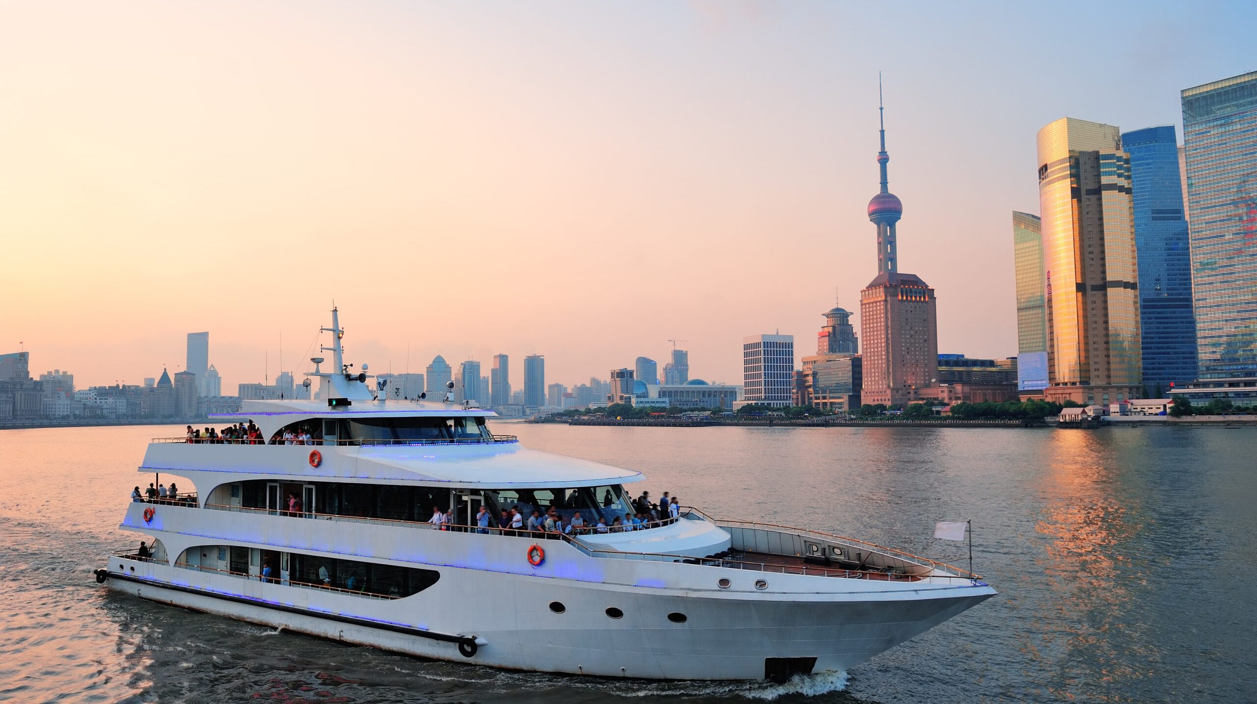 Boat in Huangpu River with Shanghai urban architecture