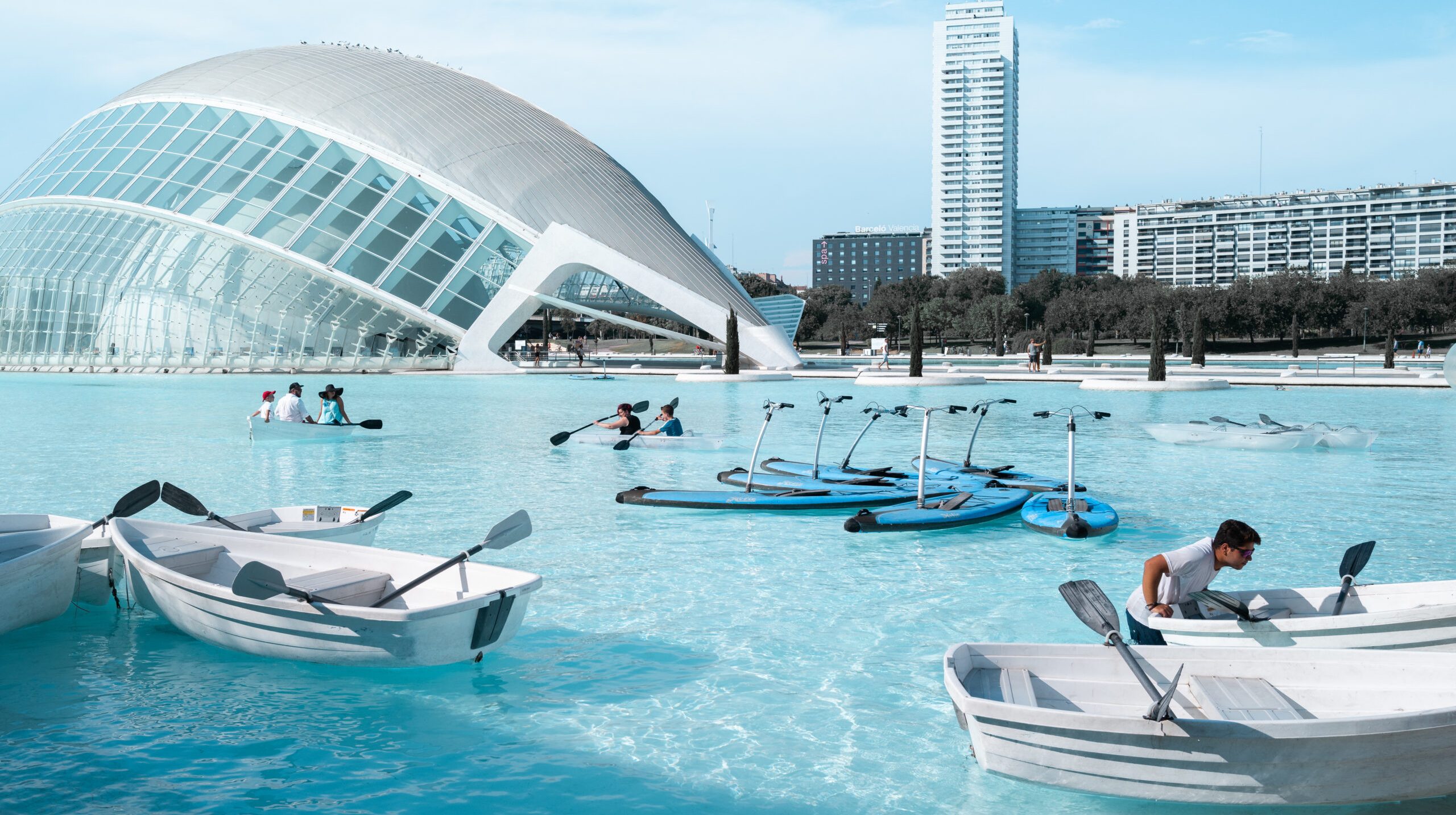 boat lot on water with people near building during daytime
