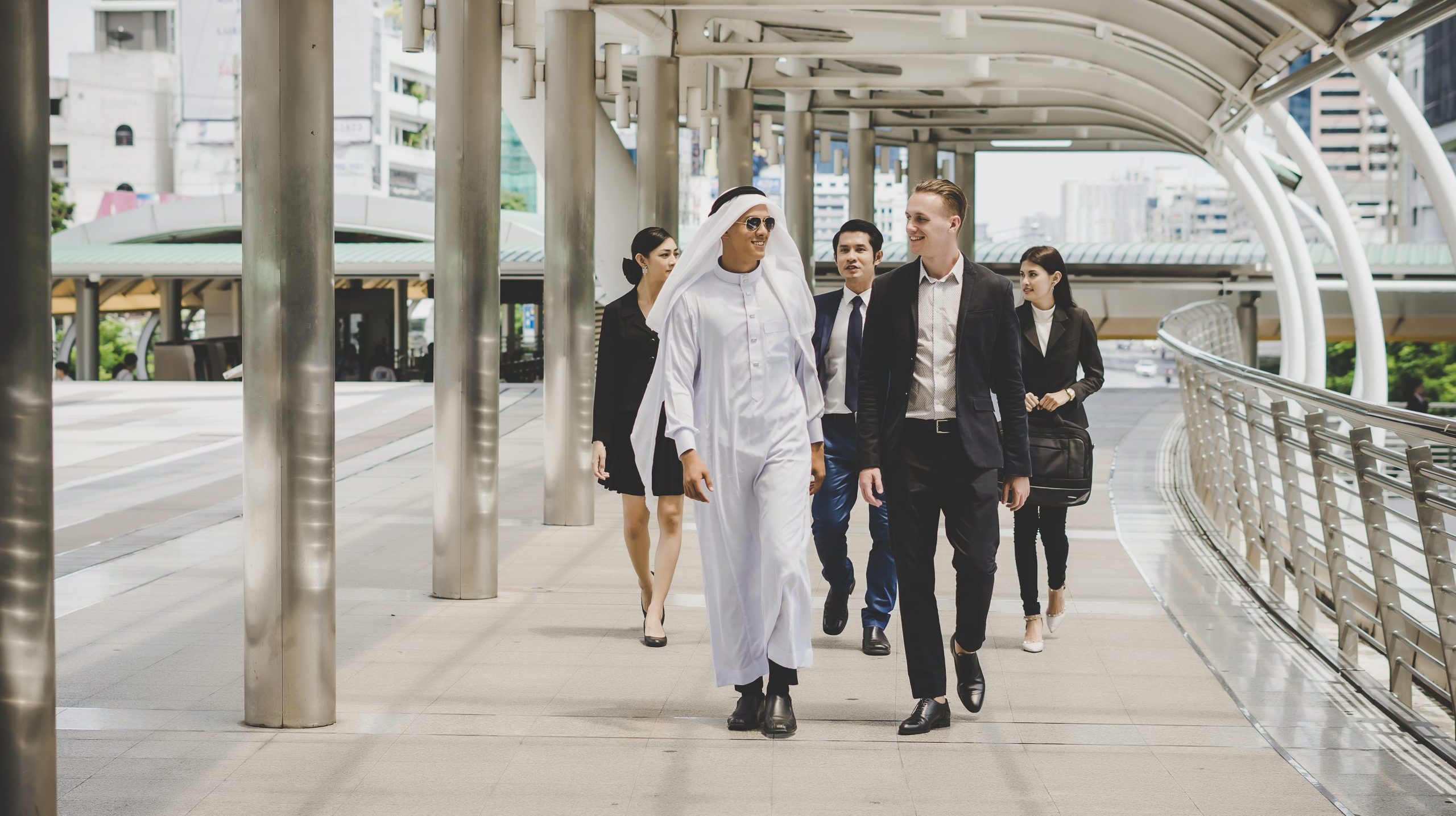 Business partners team walking down and discussing work.