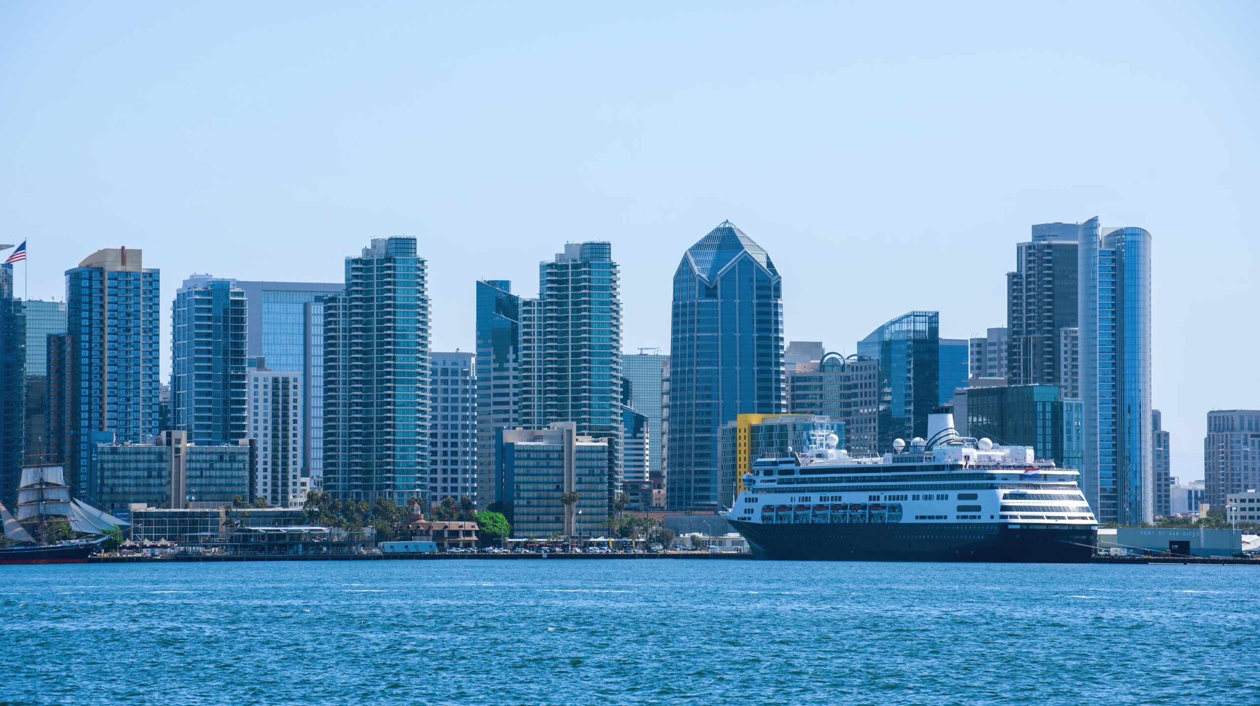 View of San Diego downtown from the water, moored ship, modern skyscrapers, USA