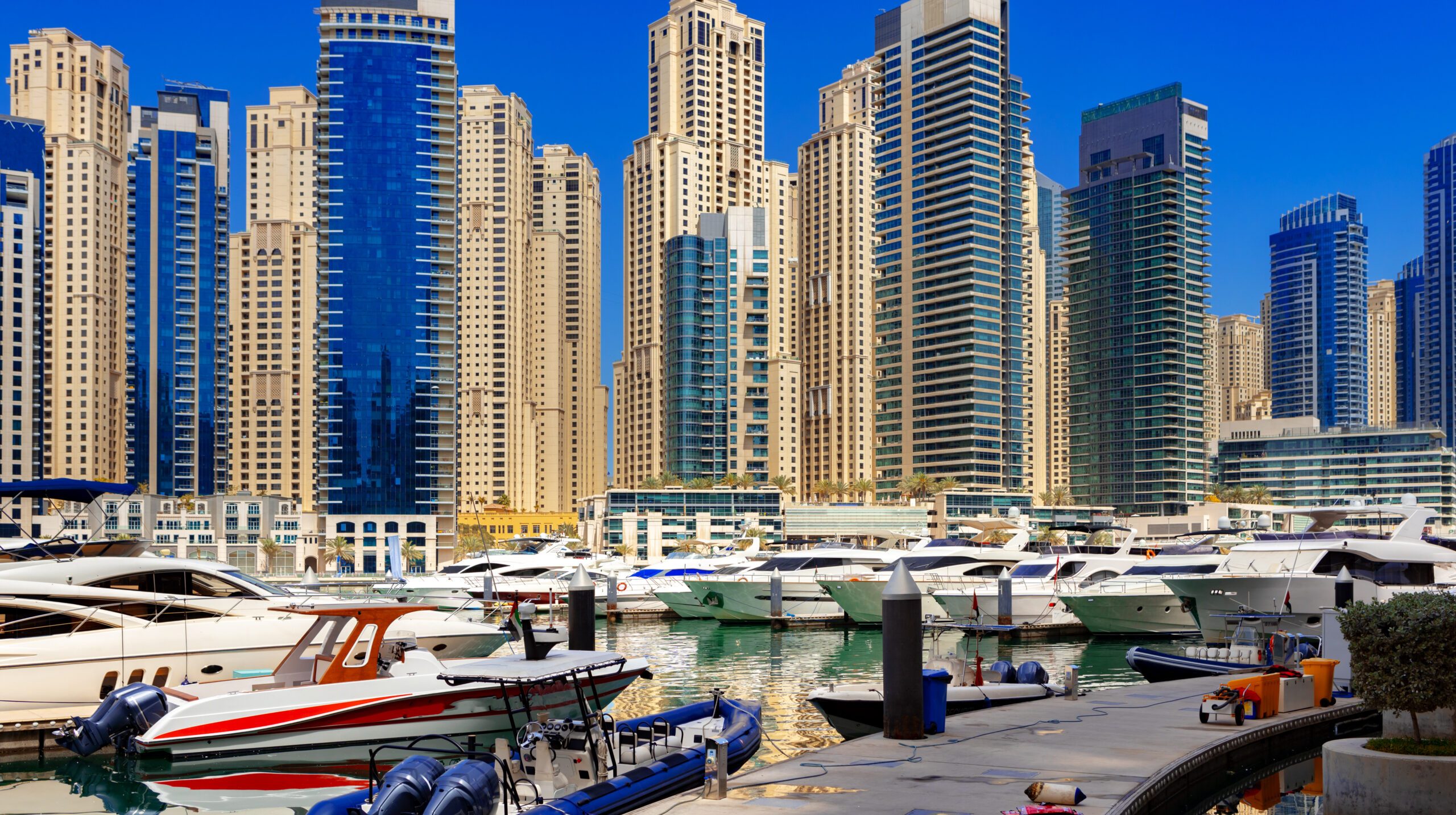 Dubai Marina skyscrapers and port in Dubai, United Arab Emirates background