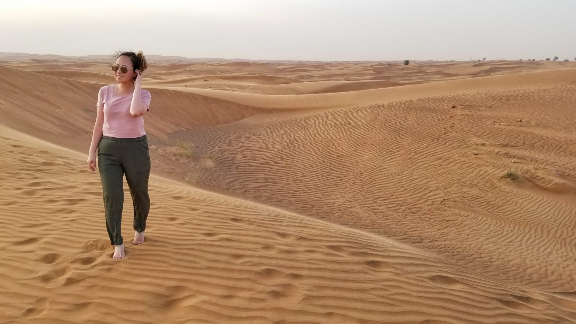 full-length-woman-walking-sand-beach