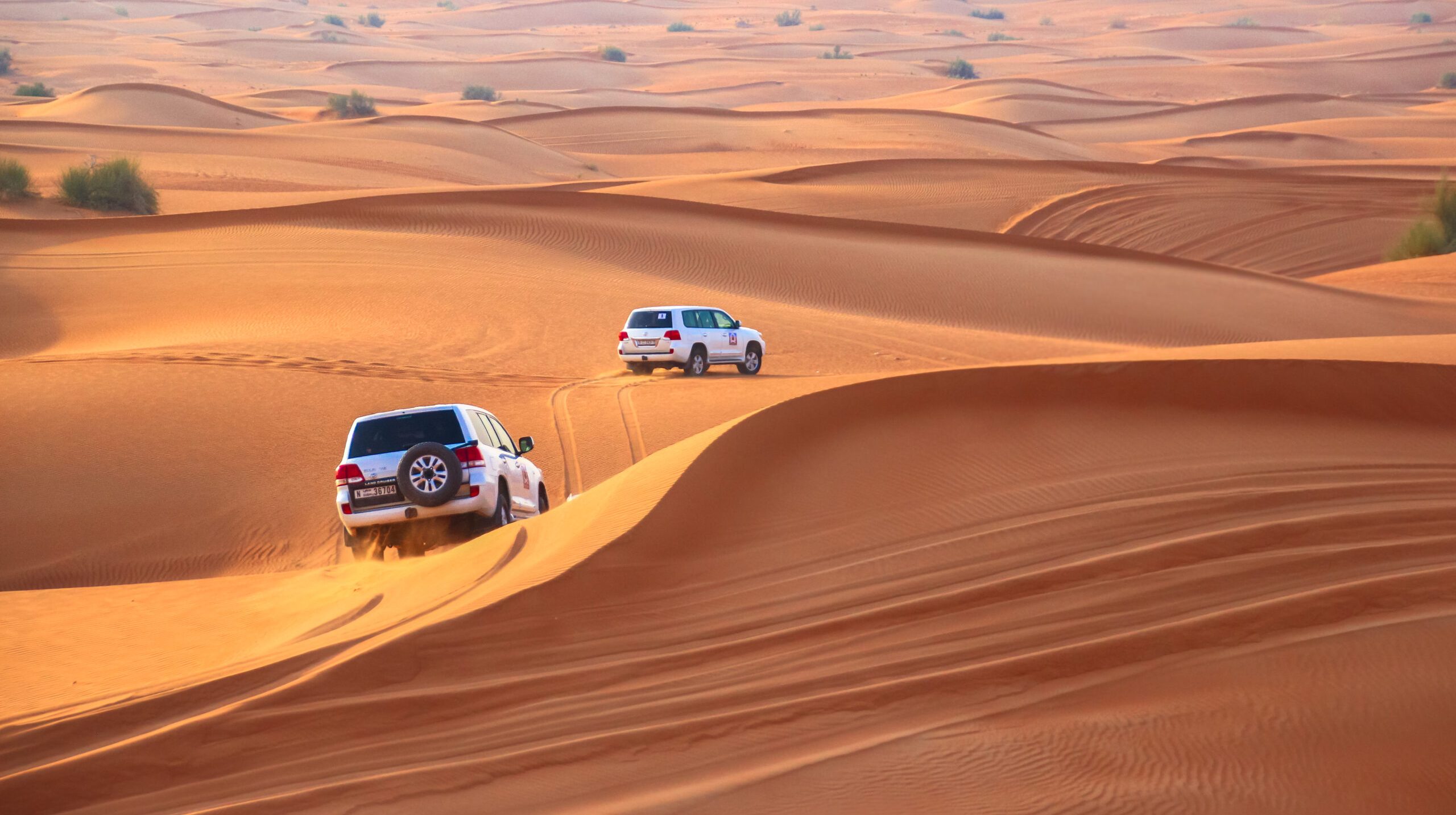 high-angle-view-off-road-vehicles-sand-dunes