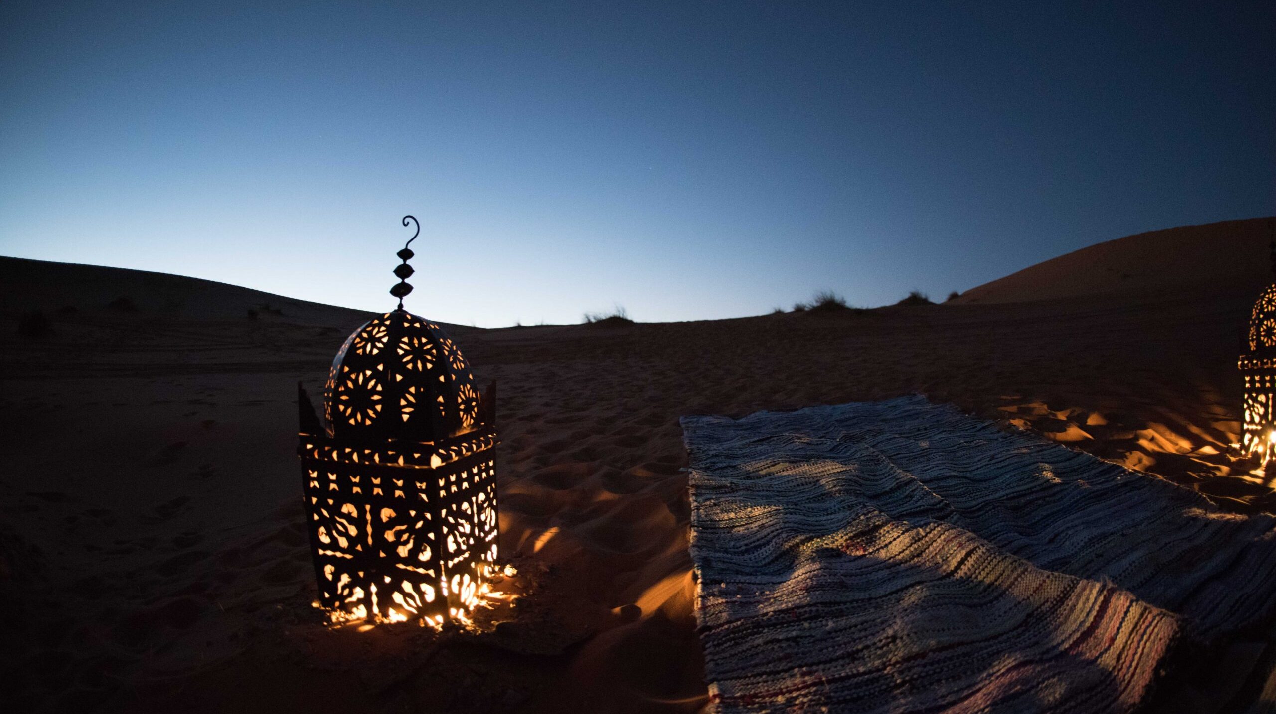 low-angle-view-illuminated-lighting-equipment-against-sky