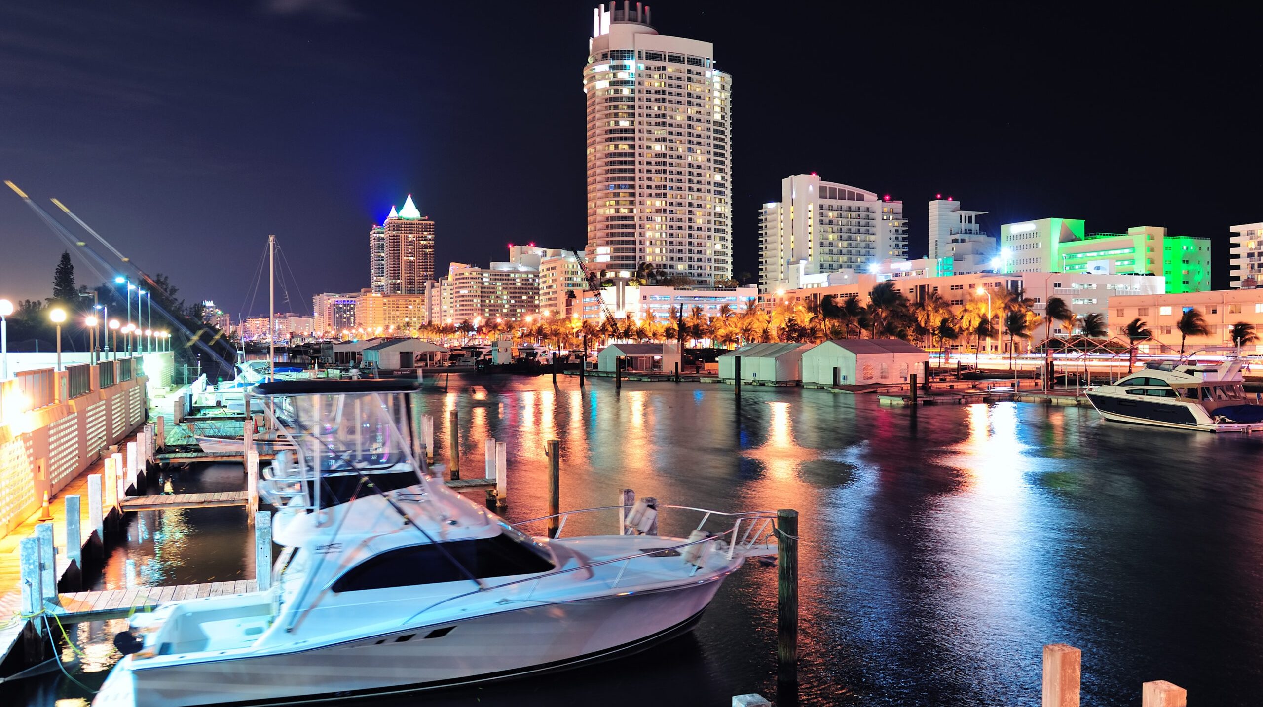 Miami south beach street view with water reflections at night