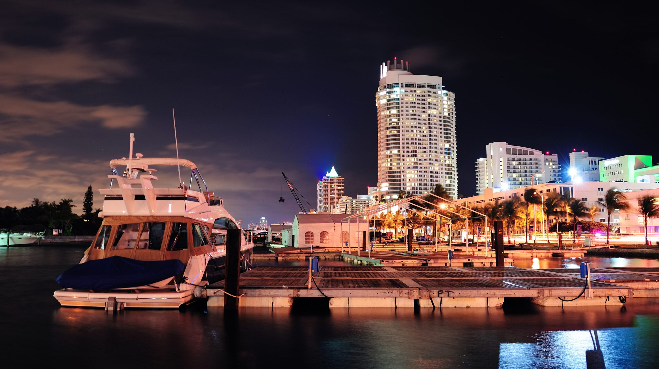 Miami south beach street view with water reflections at night