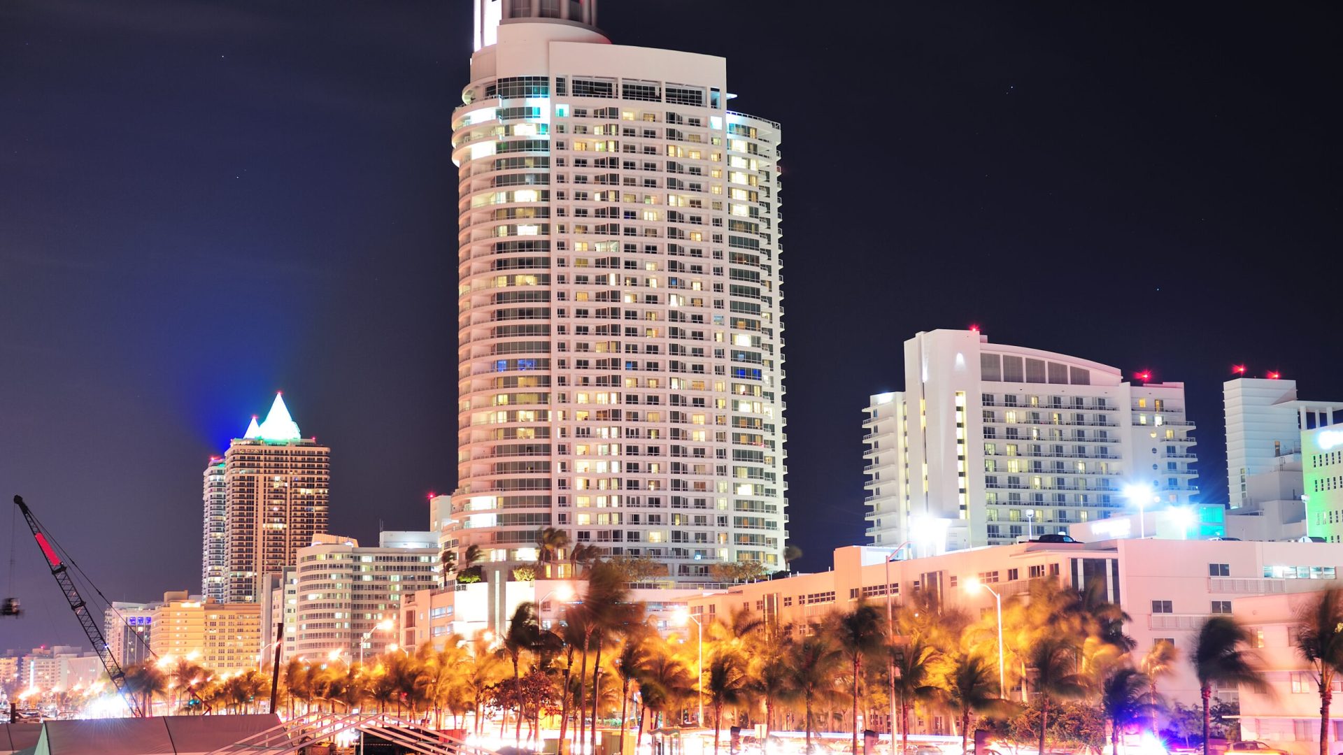 Miami south beach street view with water reflections at night