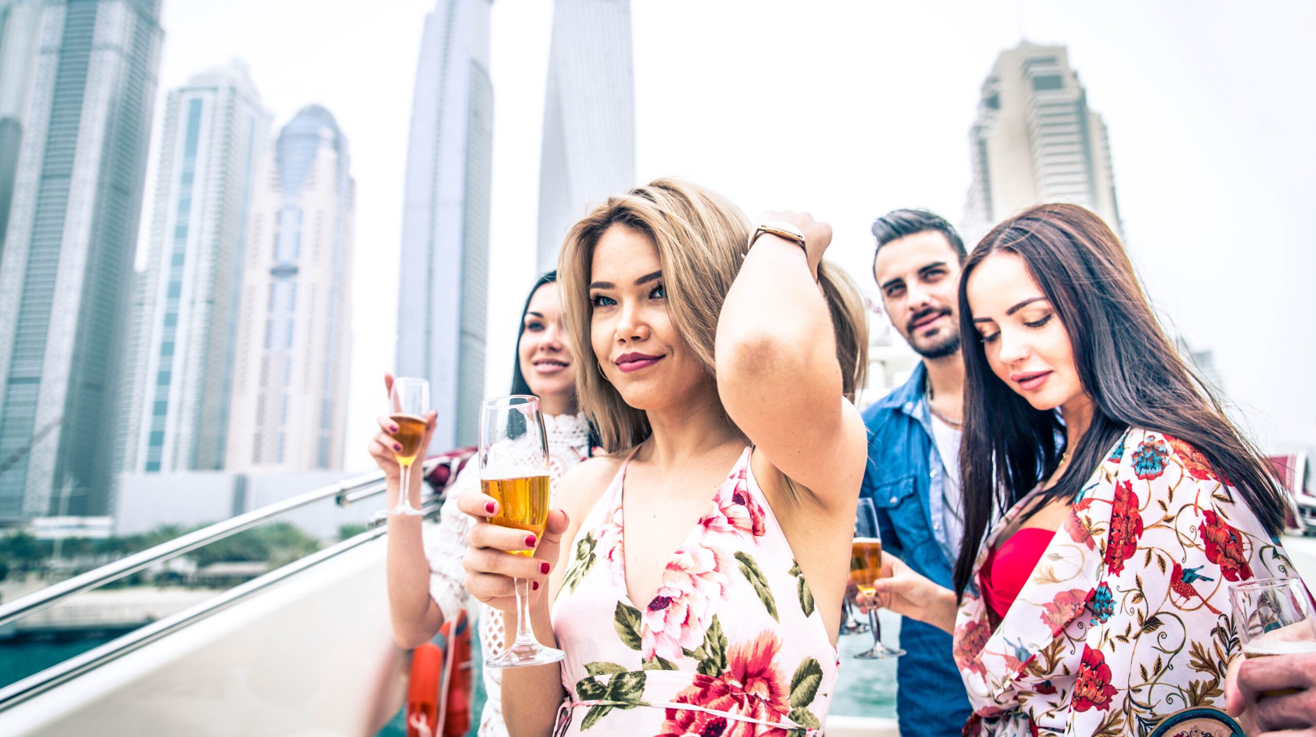 Group of friends making party on a yacht in Dubai - Happy people having a fancy party on a luxury boat