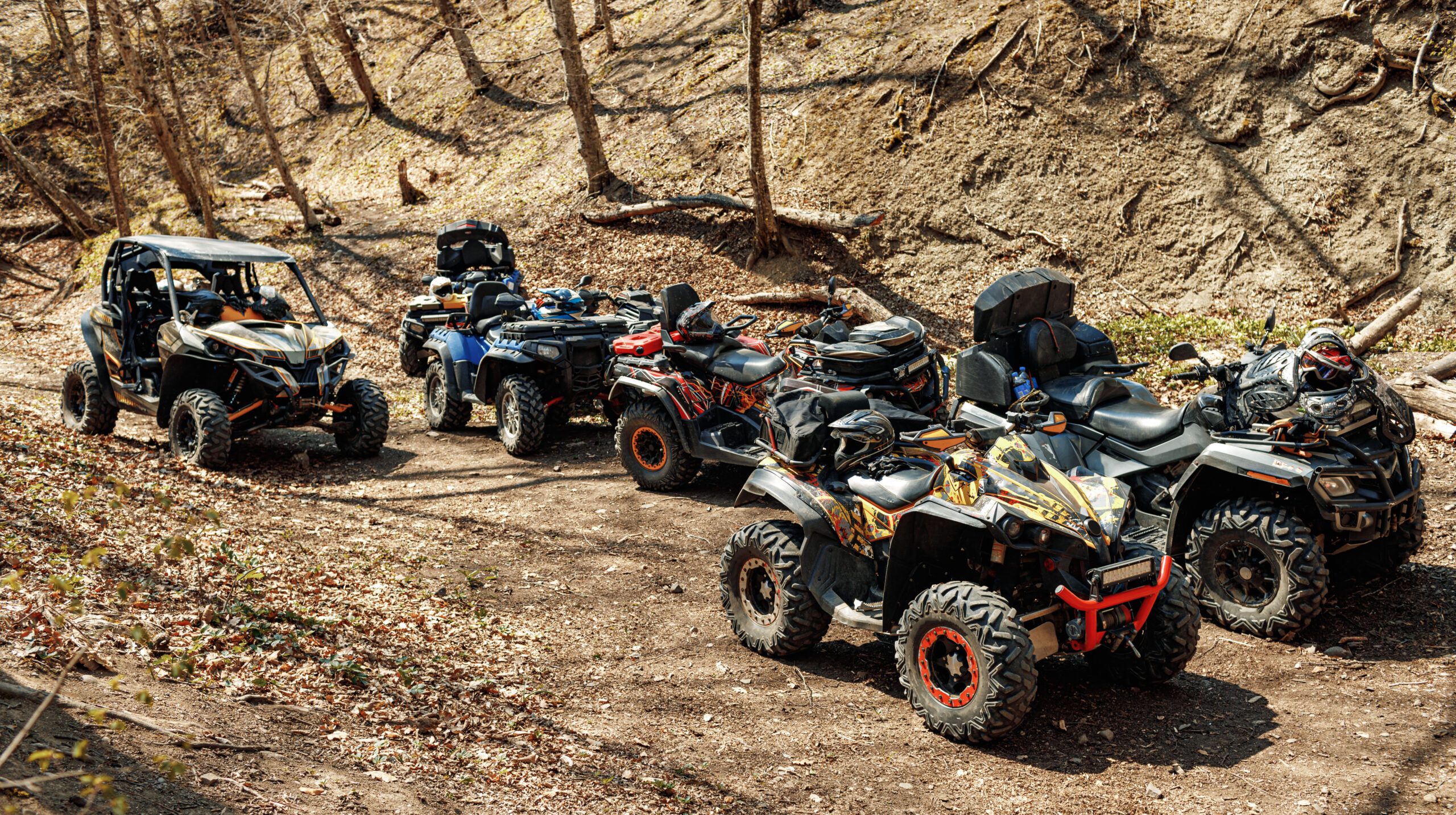 Group of Quad ATV cars all terrain vehicle parked on mountain road