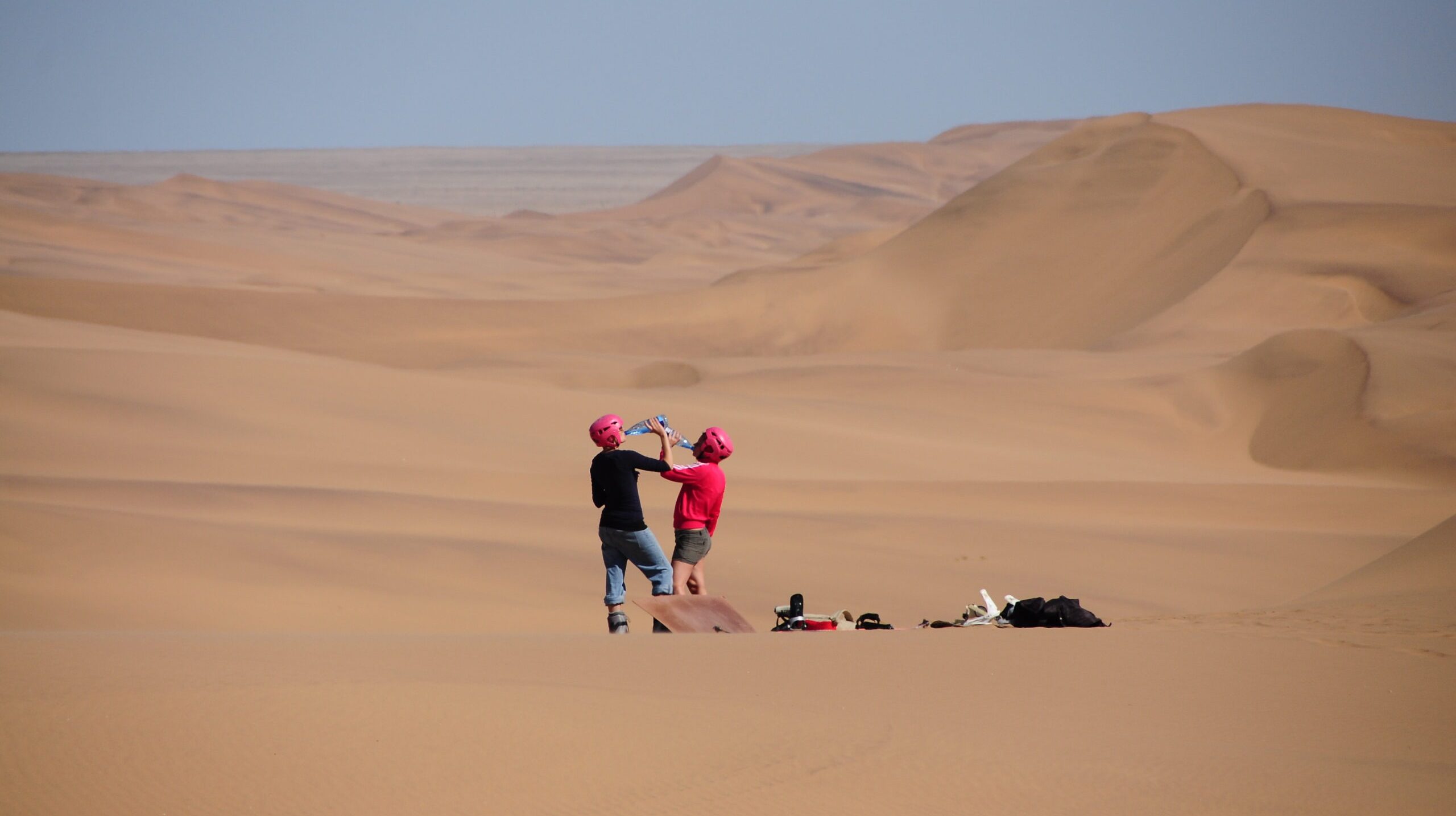 rear-view-women-drinking-water-dessert