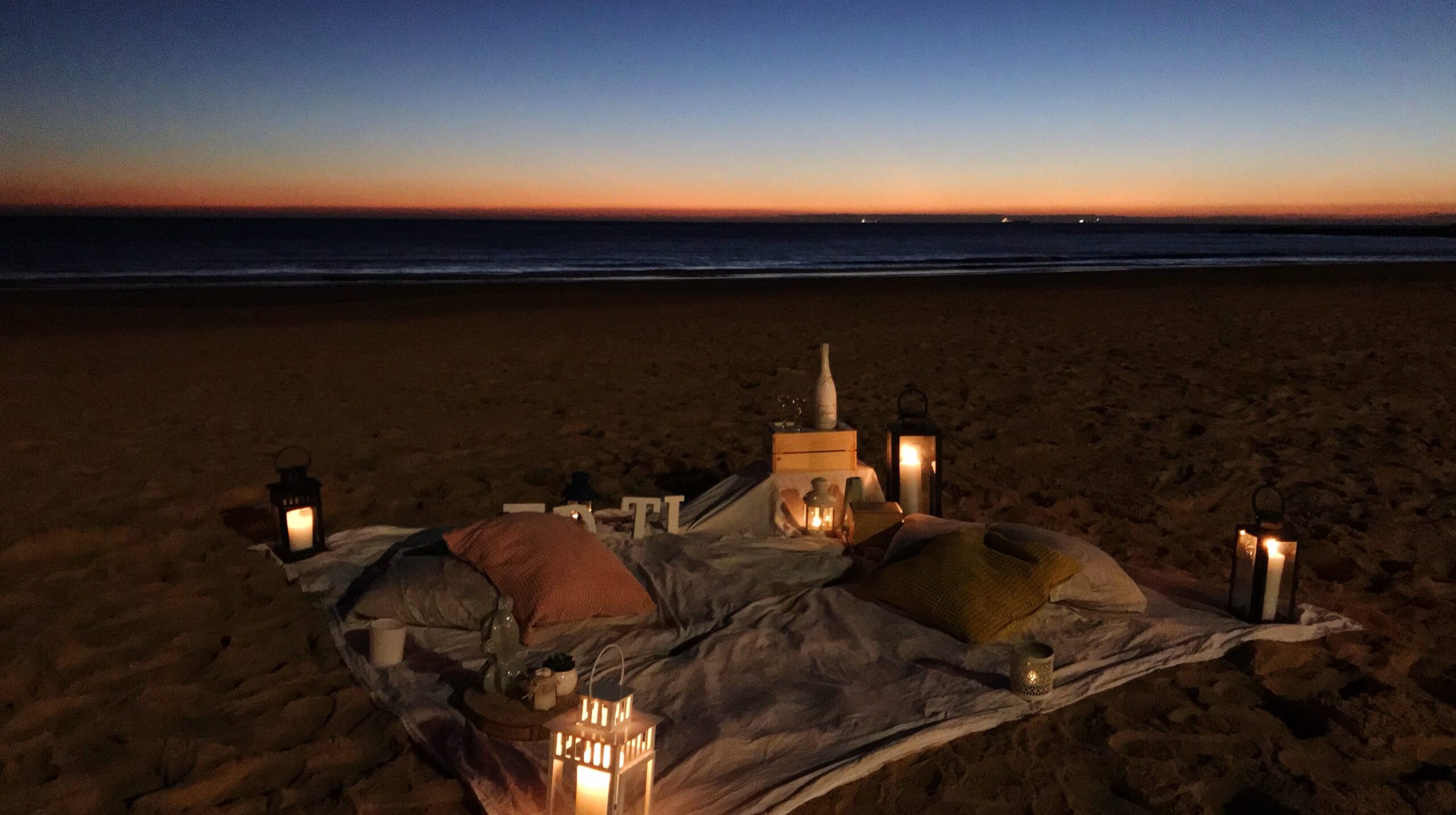 scenic-view-beach-against-clear-sky-sunset