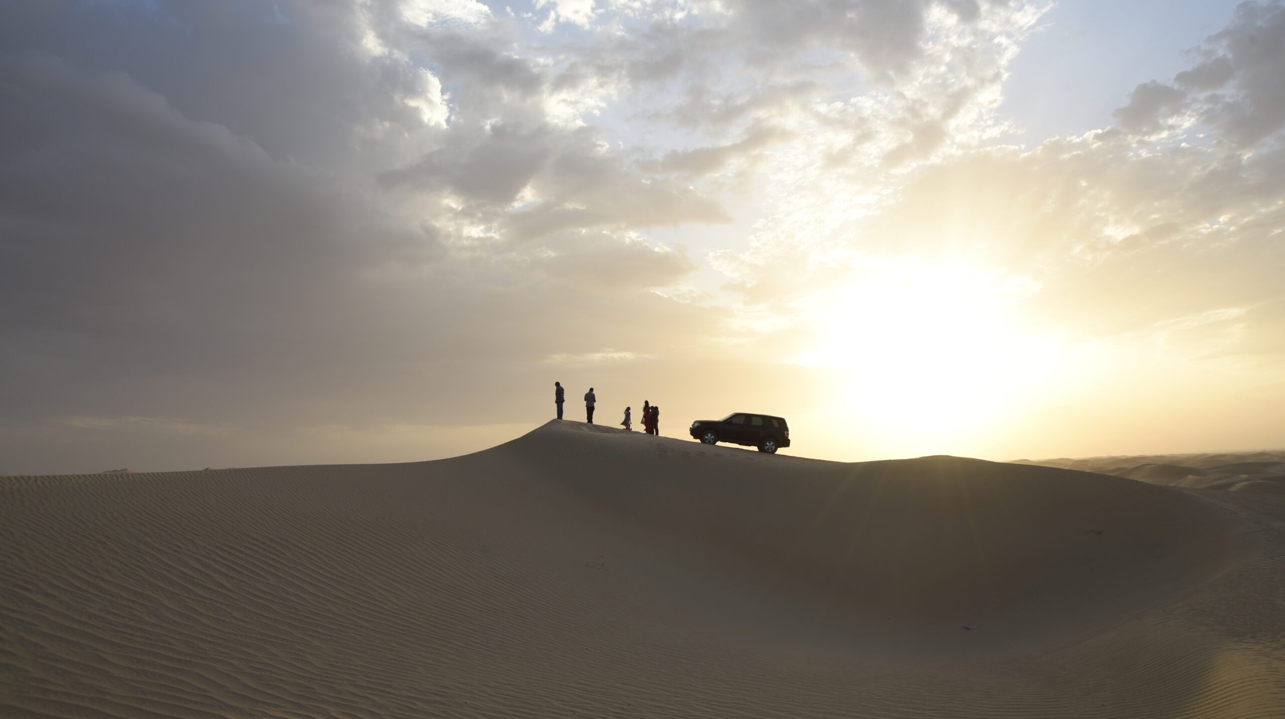 silhouette-man-desert-against-sky-sunset