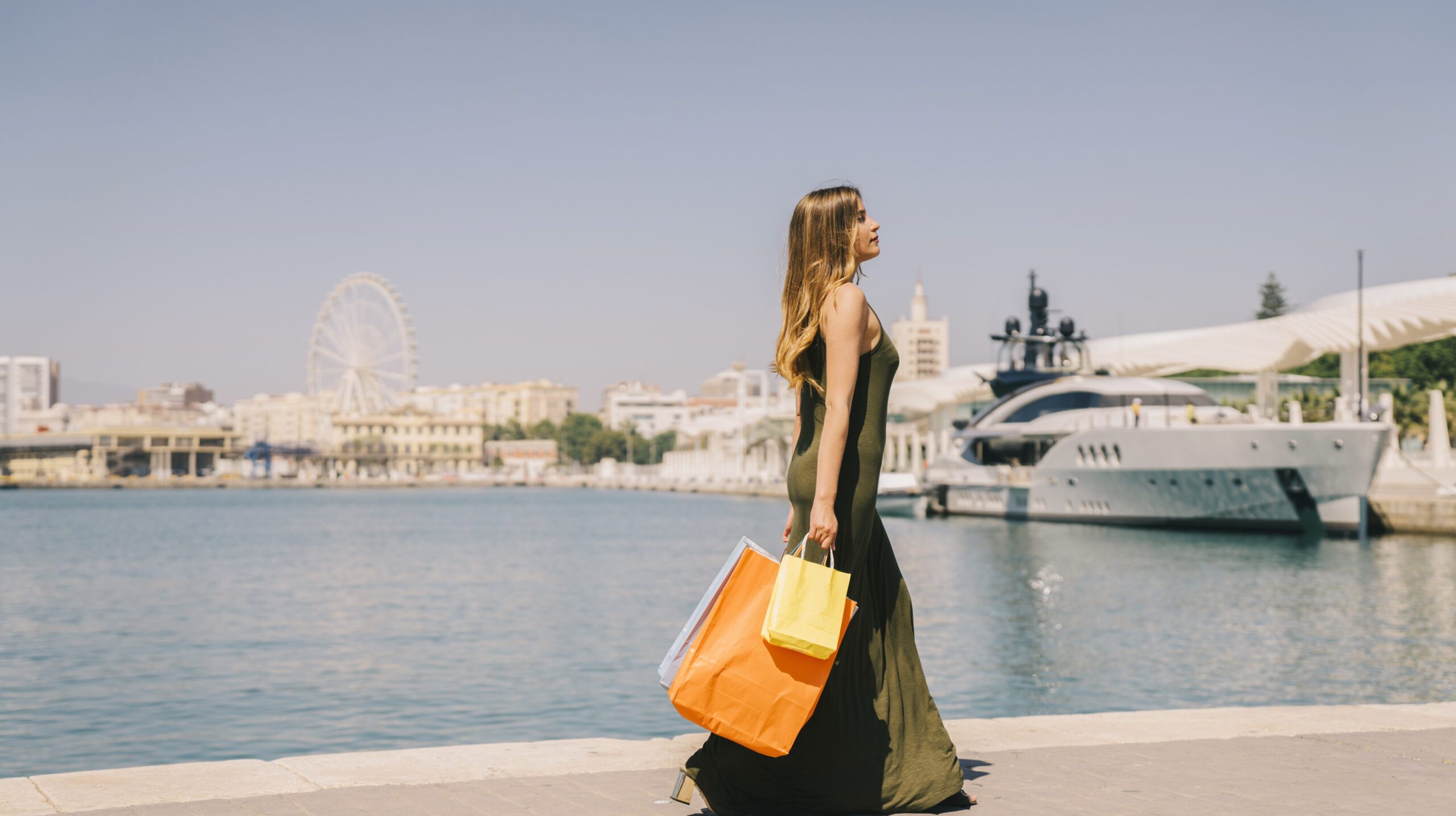 woman-walking-with-shopping-bags-seaside