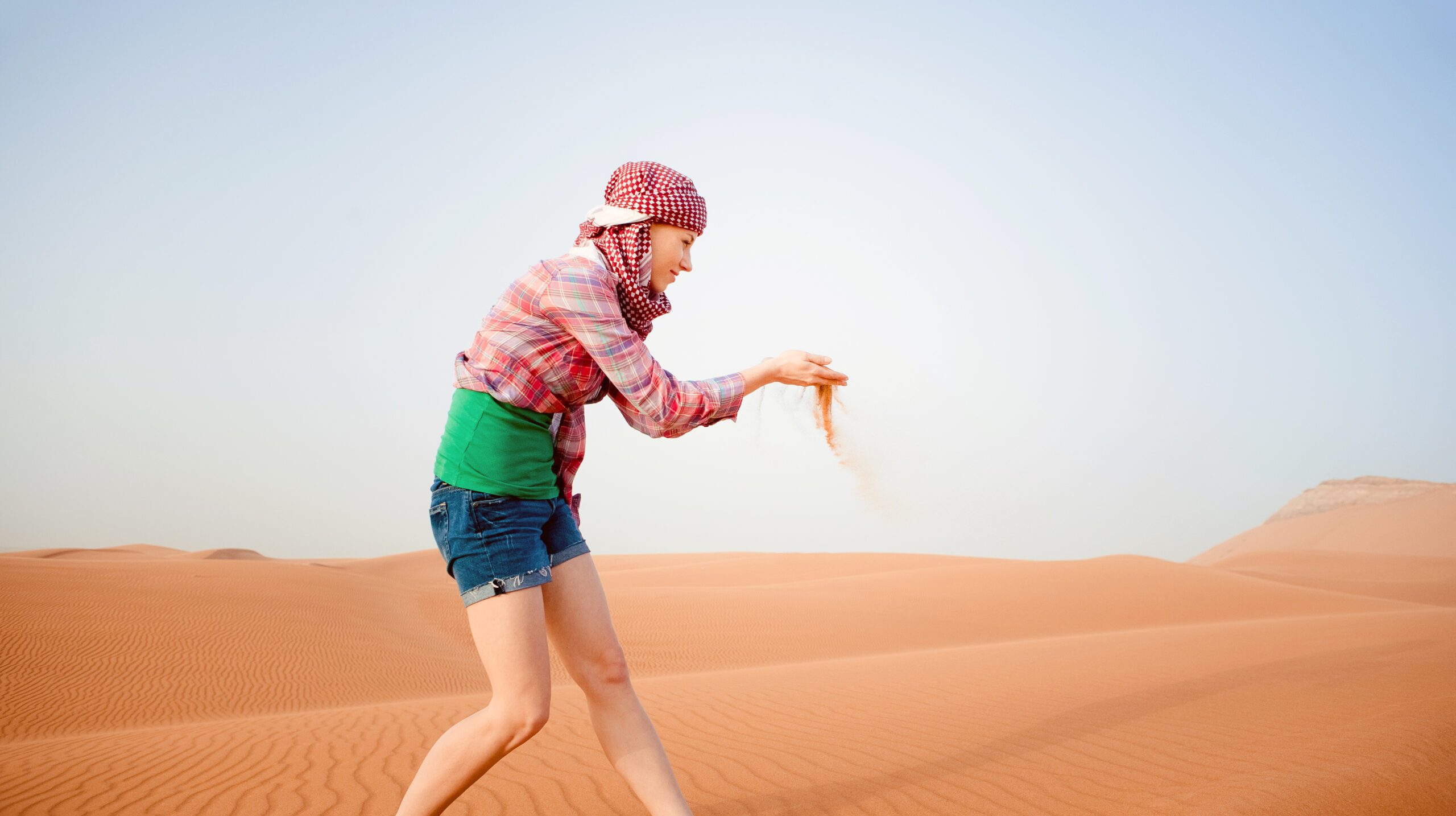 Young woman in the desert. United Arab Emirates